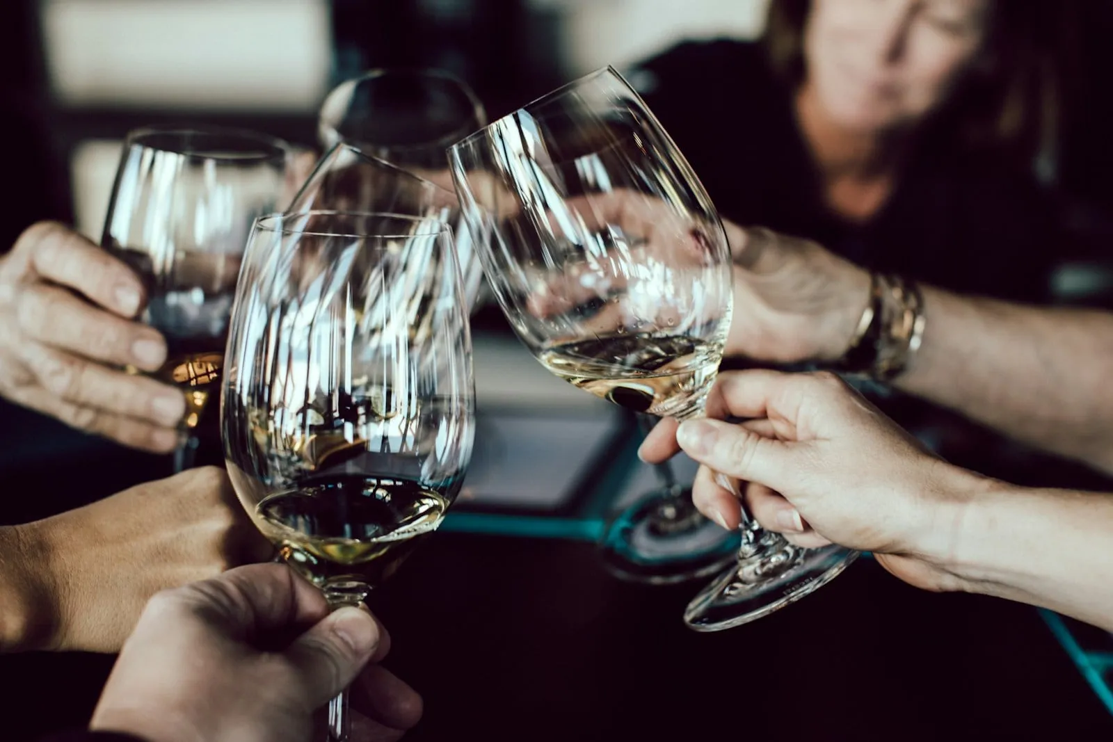 Friends raising wine glasses in a toast