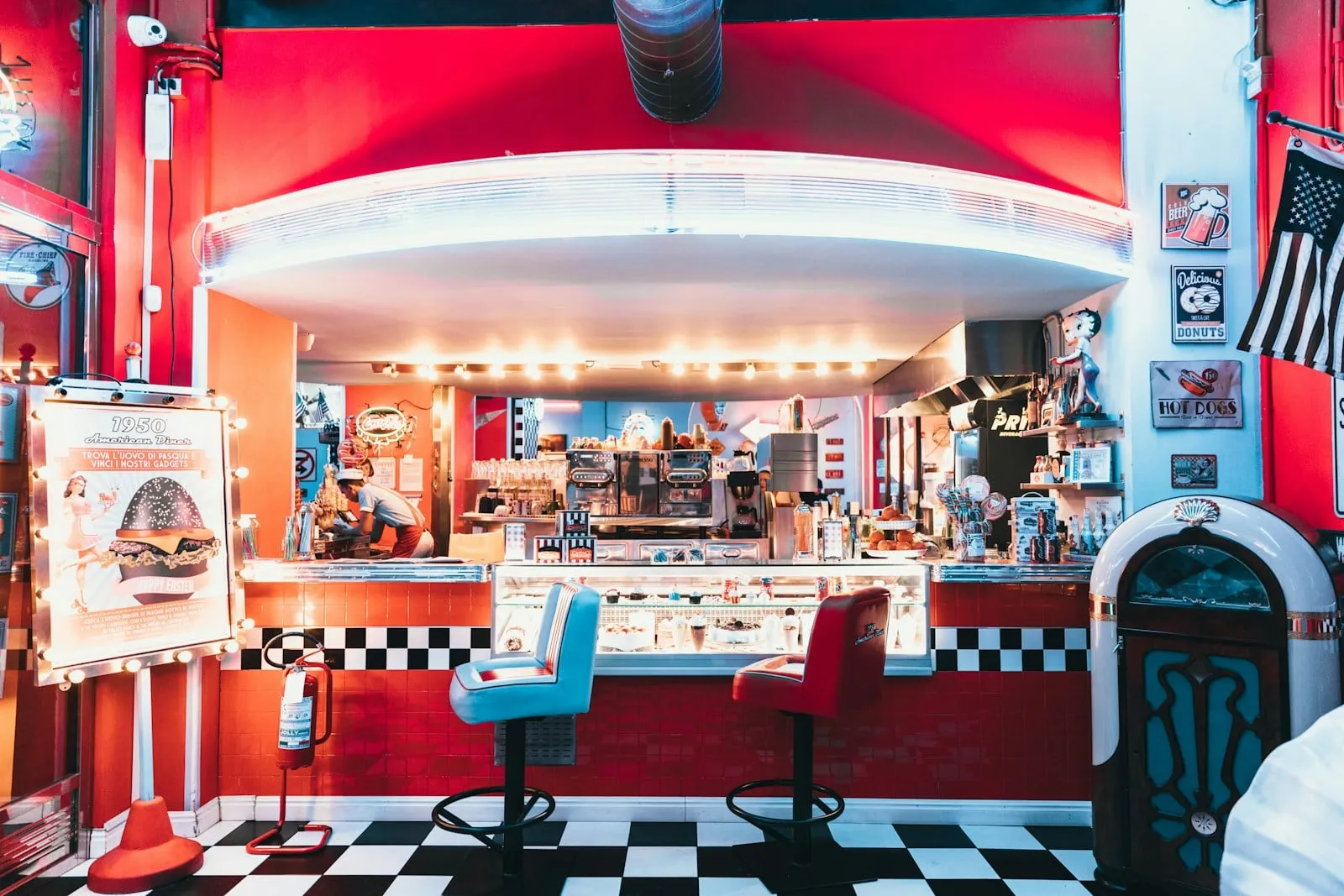 The diner counter with checkered floor and red trim