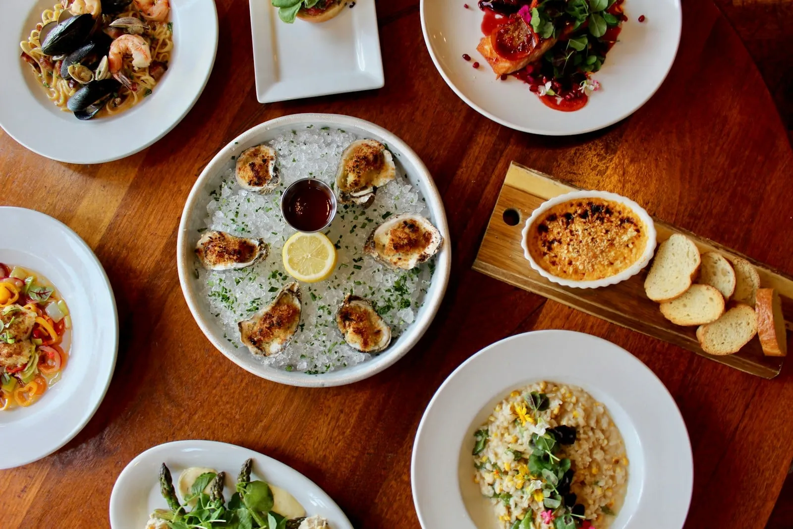 A table full of seafood dishes seen from above