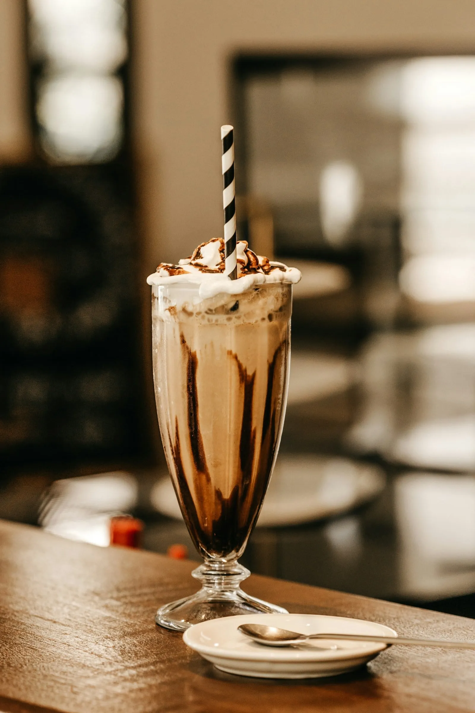 A chocolate milkshake with whipped cream