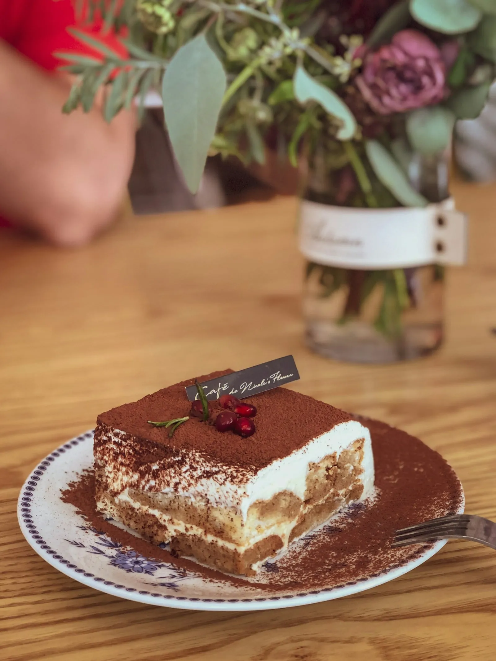 A square of tiramisu dusted with cocoa